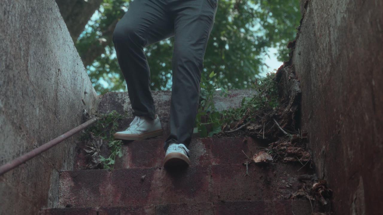 A runner bursting down a narrow alley