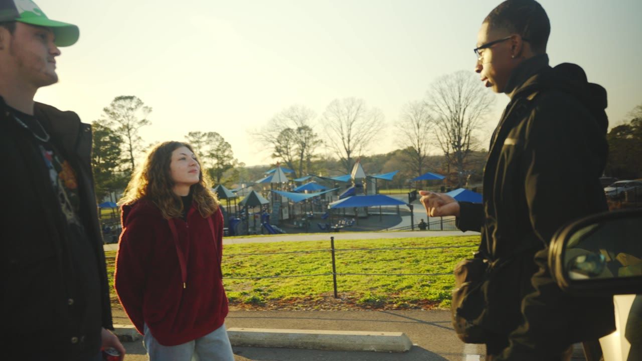 Friends talking outdoors at golden hour