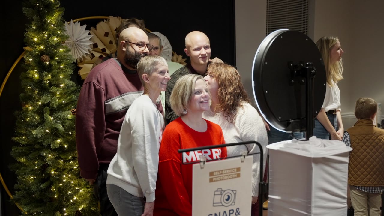 Church members posing at a Christmas photo booth
