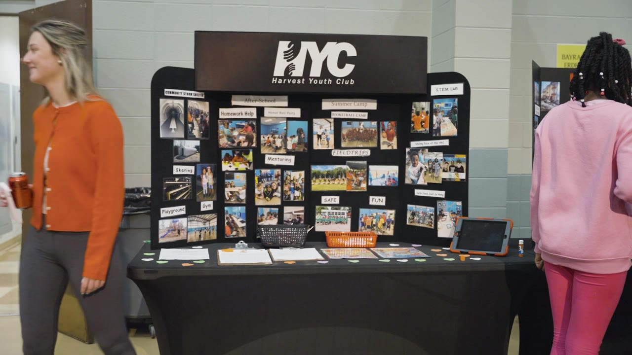 Visitors at a missions display table